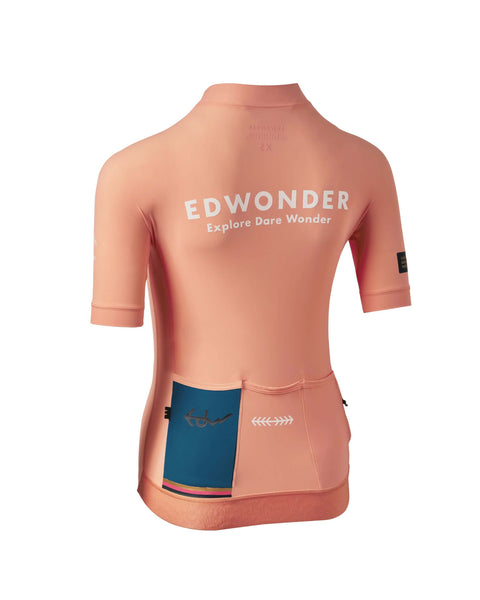Womens EdW Edition Jersey 3.0 in Porsche Peach, featuring a stylish design with pockets for cycling essentials.